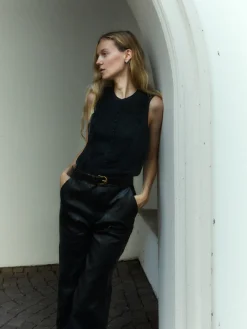 Sleeveless Ruffle Trim Blouse in Black